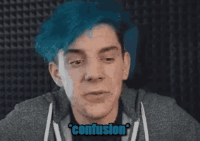 a man with blue hair is making a funny face and the word confusion is on the bottom