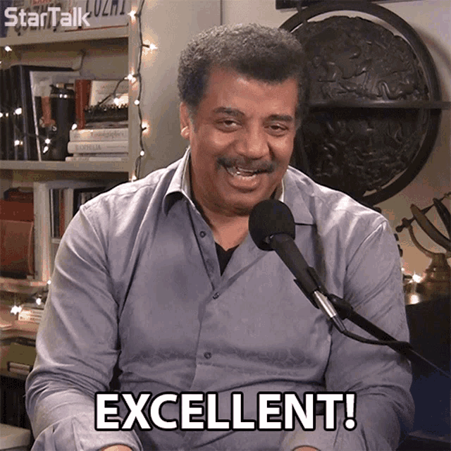 a man with a microphone says excellent