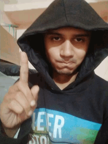 a man wearing a black hoodie with the word never on the front