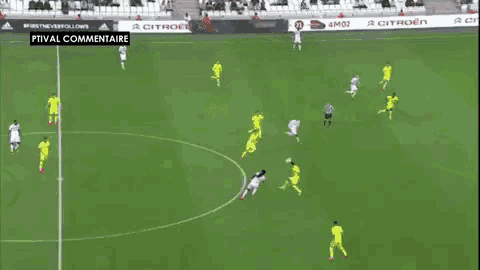a soccer game is being played on a field with a guinot ad in the background