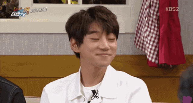 a man with his eyes closed is on kbs2 television