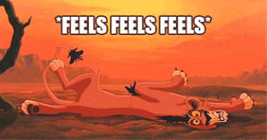 a cartoon of a lion laying on its back with the words feels feels feels below it
