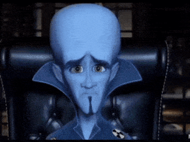 a cartoon character with a big head is sitting in a chair with his head down
