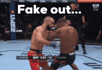 two men fighting in a boxing ring with the words fake out
