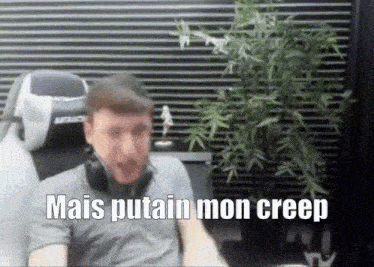 a man sitting in a chair with the words mais putain mon creep written below him