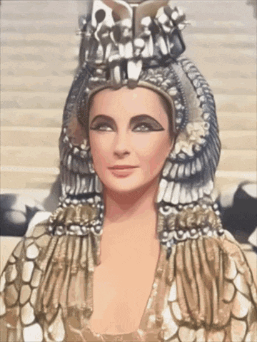 a woman with a crown on her head and a gold dress