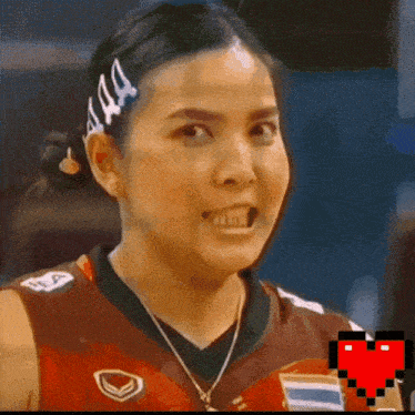a woman with a headband that says aaa looks angry