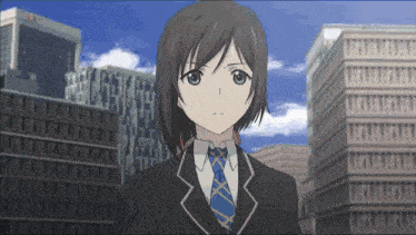 a girl in a suit and tie is standing in front of a city skyline