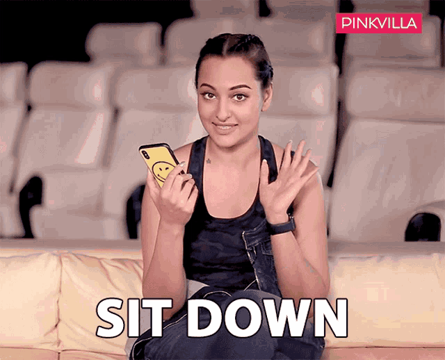 a woman sits on a couch holding a cell phone with the words sit down written below her