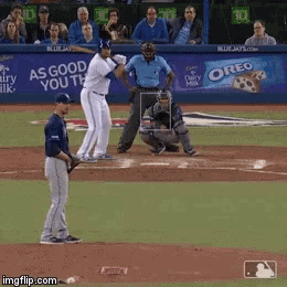 a baseball game is being played with an oreo ad in the outfield