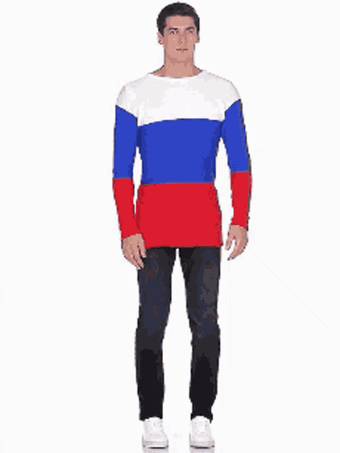 a man is wearing a red white and blue shirt and black jeans