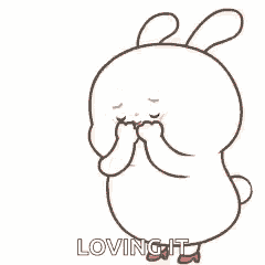 a cartoon rabbit is holding its hands to its face in front of a heart and loving it .