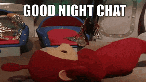 a red teddy bear laying on the floor with the words good night chat written above it