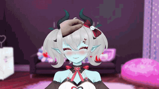 a girl with horns and a heart on her chest is smiling