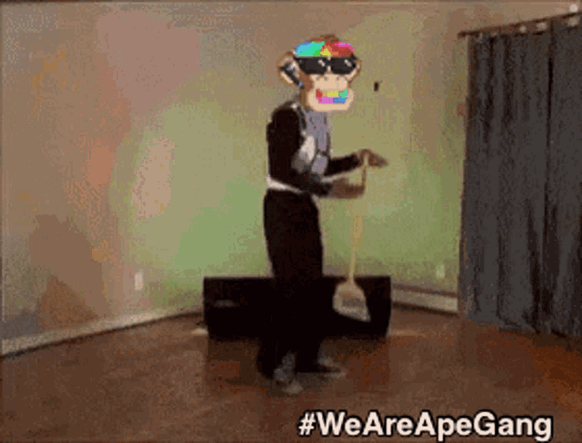 a man in a monkey costume is holding a broom in a room with #wearepapegang written on the bottom