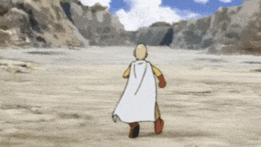 a bald man in a white cape is running through a desert .