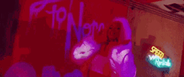 a neon sign that says speed world in purple