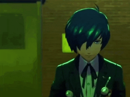 a man in a suit is pointing a gun at his head