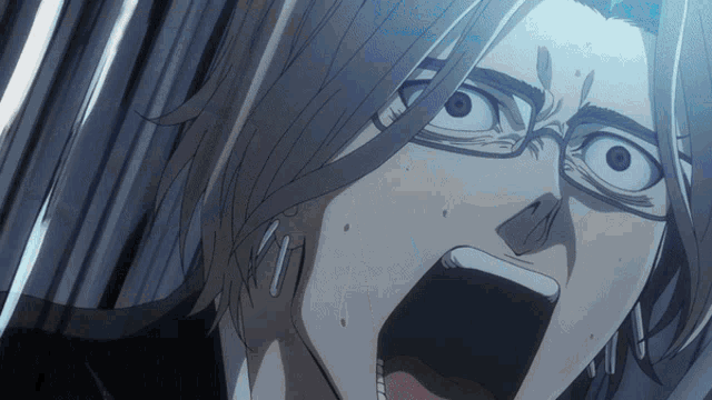 a close up of a person 's face with their mouth wide open
