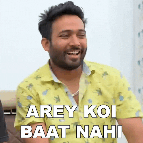 a man wearing a yellow shirt is laughing and saying arey koi baat nahi