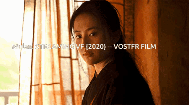 a woman stands in front of a window with the words mulan streaming vf 2020 - vostfr film below her