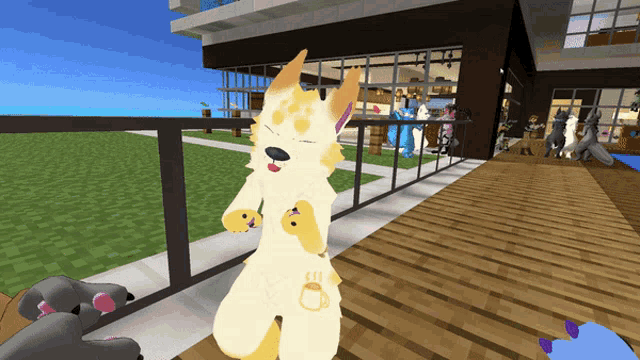 a yellow and orange furry animal is standing on a balcony in front of a building