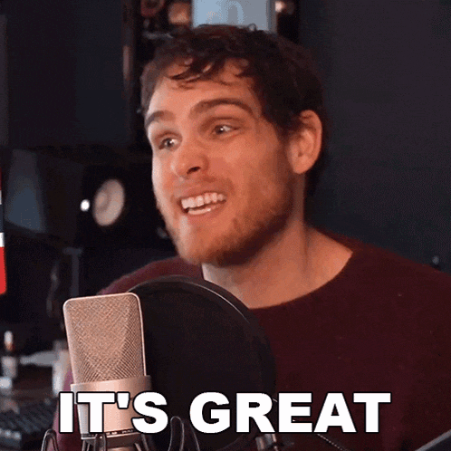 a man speaking into a microphone with the words it 's great written below him