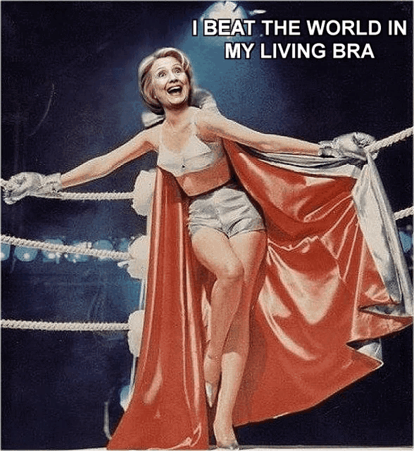 a woman in a cape is in a boxing ring with the caption i beat the world in my living bra