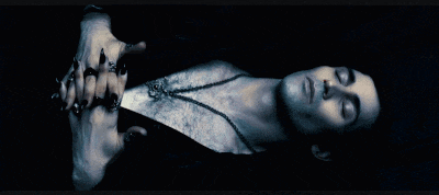 a man is laying down with his eyes closed