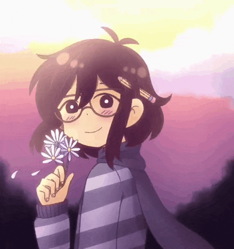 a girl with glasses is holding a flower and smiling