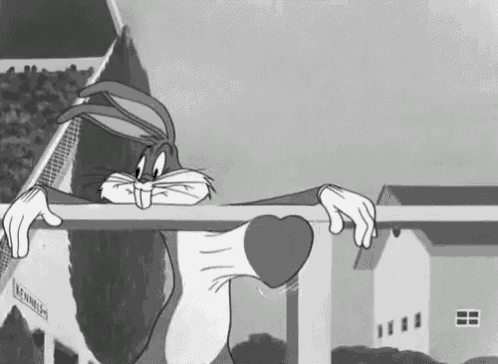 bugs bunny is peeking over a fence in a black and white cartoon