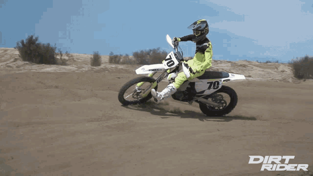 a dirt rider riding a dirt bike on a dirt track