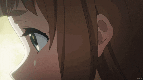 a close up of a girl 's face with an anime.tv logo