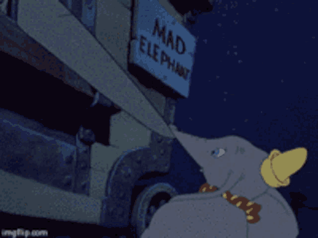 dumbo is standing in front of a sign that says mad elephants