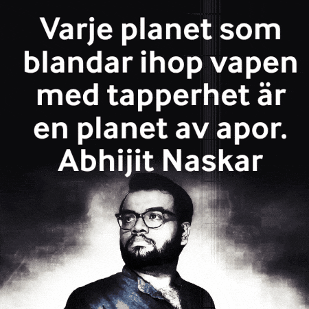 a man with glasses and a beard stands in front of a black background with foreign text