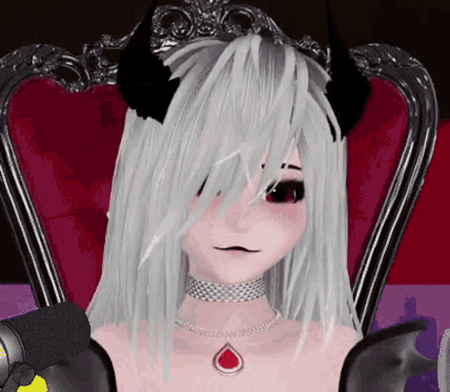a girl with white hair and black horns is sitting in a chair with a microphone .