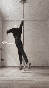 a black and white photo of a pole dancer with the words viggle.ai in the upper right corner