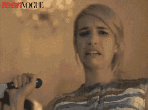 a woman making a funny face with teen vogue in the background