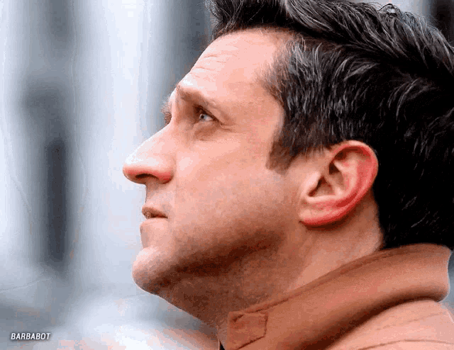 a close up of a man 's face with barbabot written in the corner