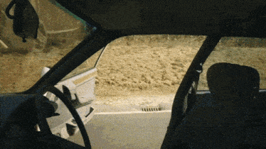a car is parked on the side of the road