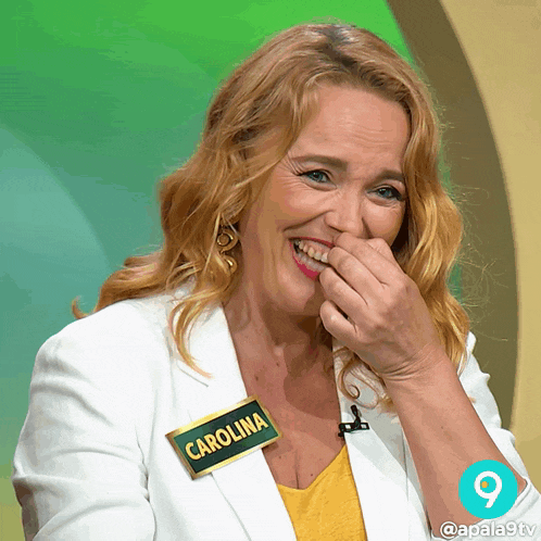 a woman wearing a name tag that says carolina laughs