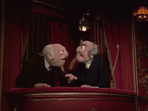 a couple of muppets are sitting on a balcony talking to each other