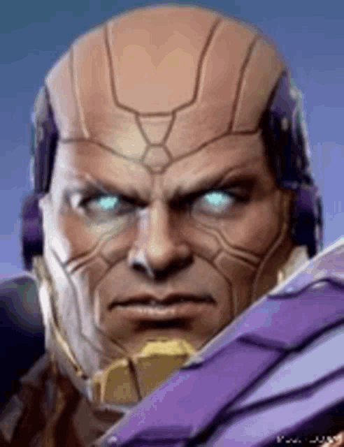 a close up of a man 's face with blue eyes and a purple helmet .
