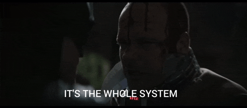 a close up of a man with the words it 's the whole system