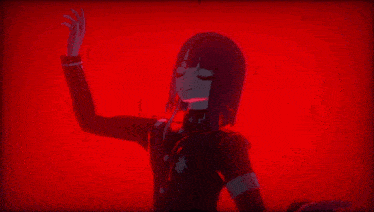 a girl with black hair is standing in front of a red wall