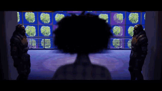 a person standing in front of a window with a silhouette of a person behind them