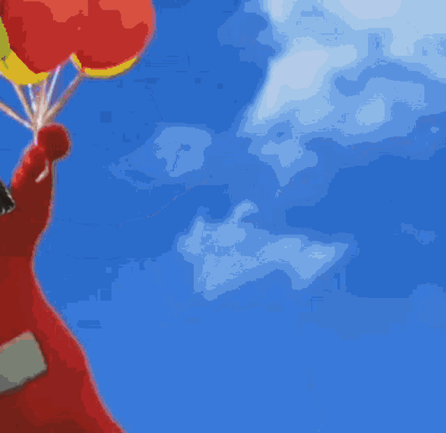 a little girl in a red outfit is holding balloons