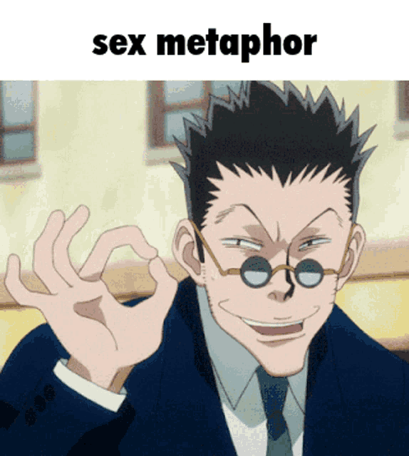 a man in a suit and tie giving an ok sign with the words sex metaphor written above him