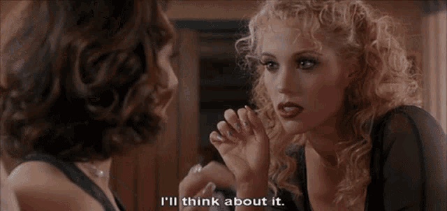 a woman says i 'll think about it while another woman looks on