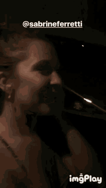 a close up of a woman 's face with the name sabrine ferretti written above her